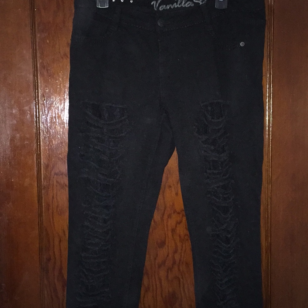 Distressed black skinny jeans
